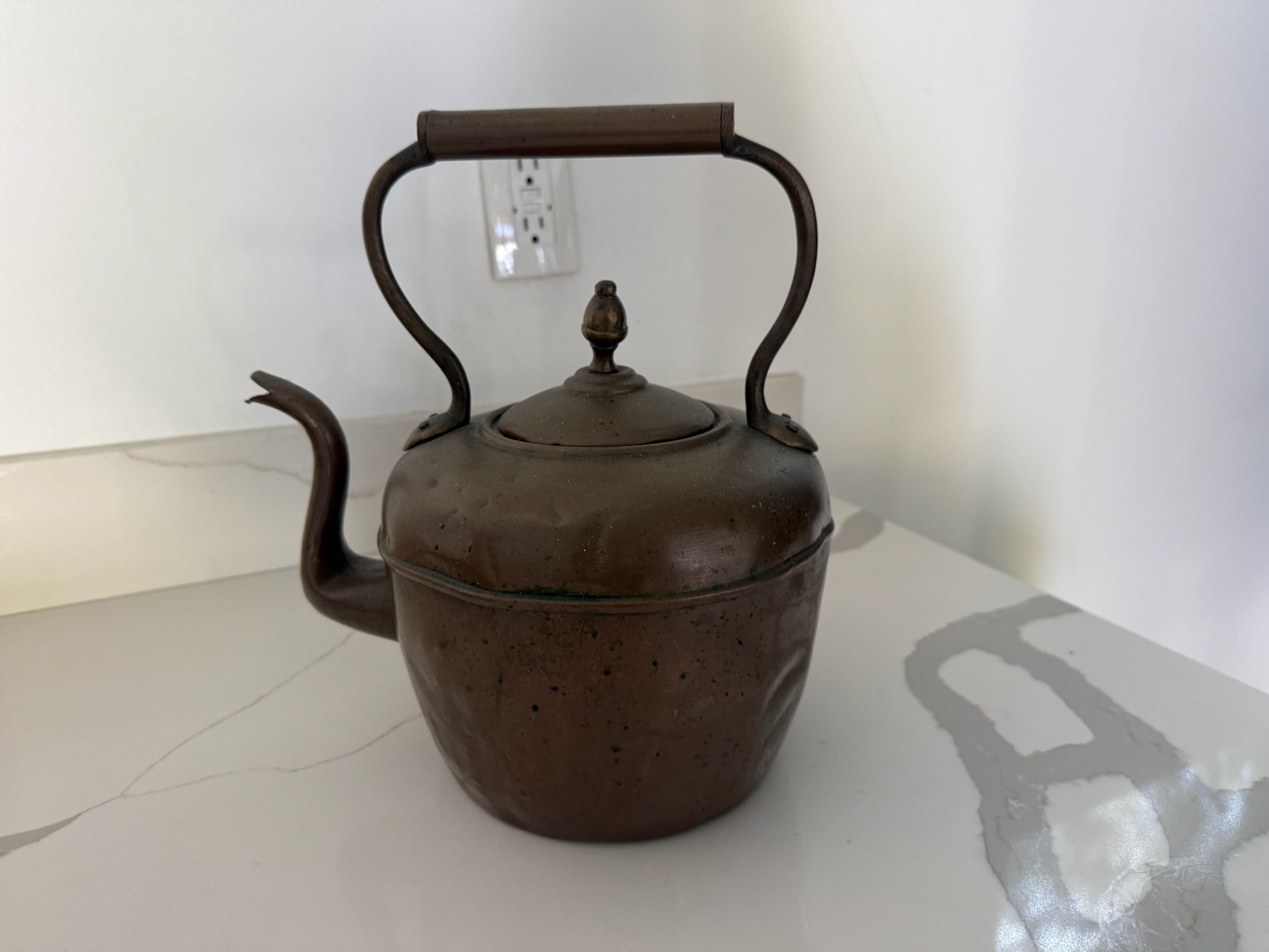 Vintage cast iron teapot with curved handle