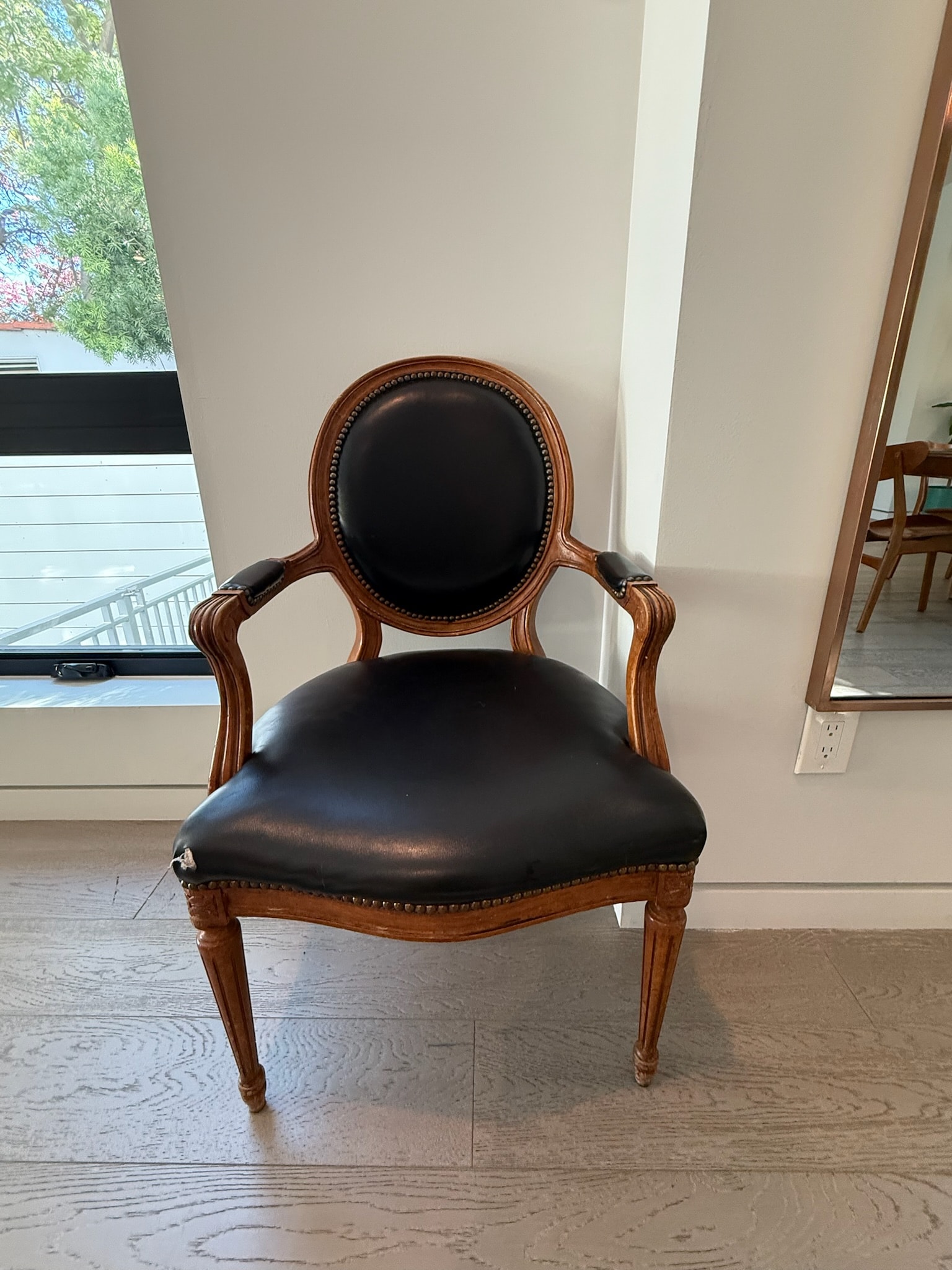 Antique wooden chair black leather seat