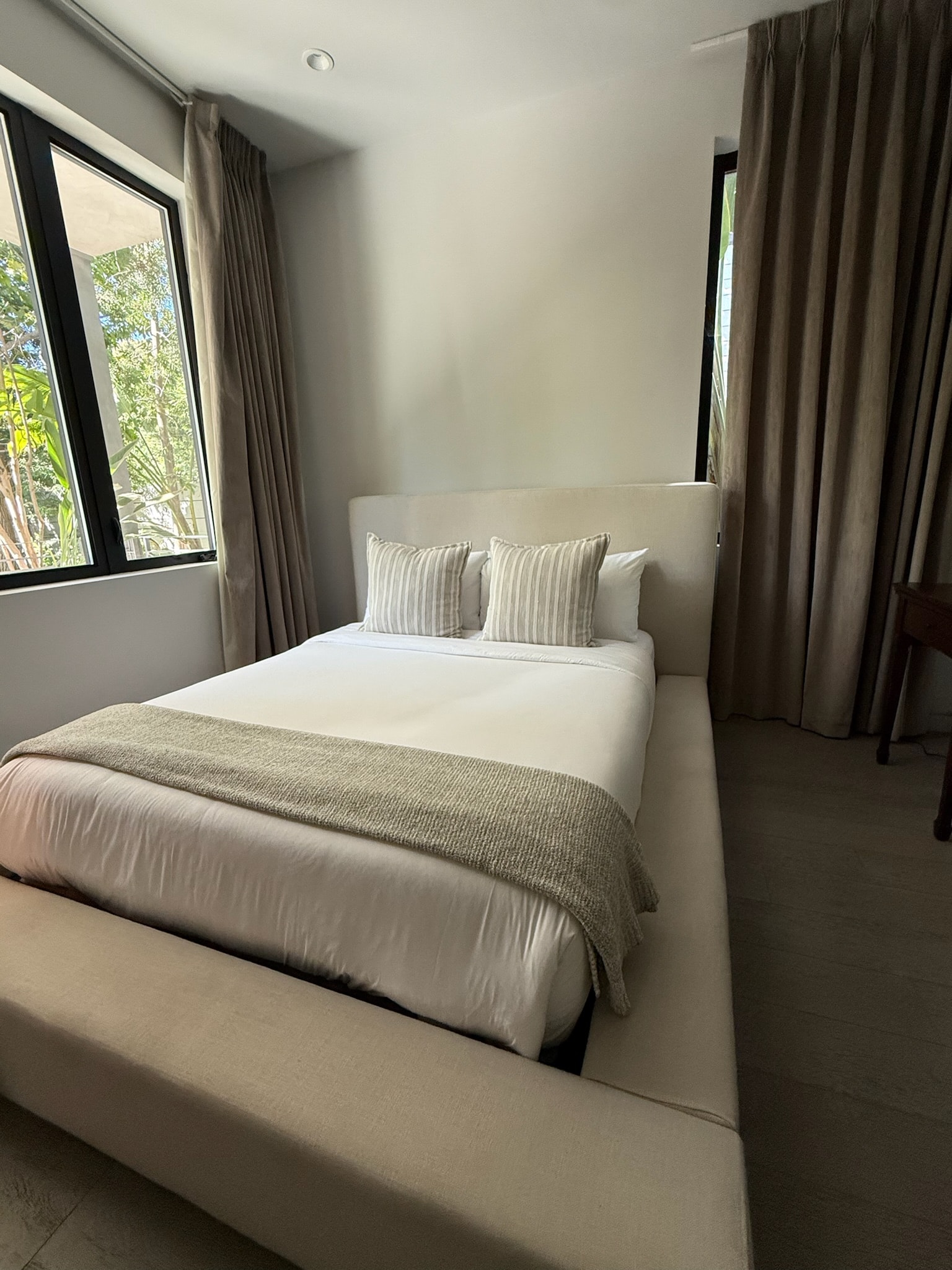 Modern minimalist bedroom with natural light