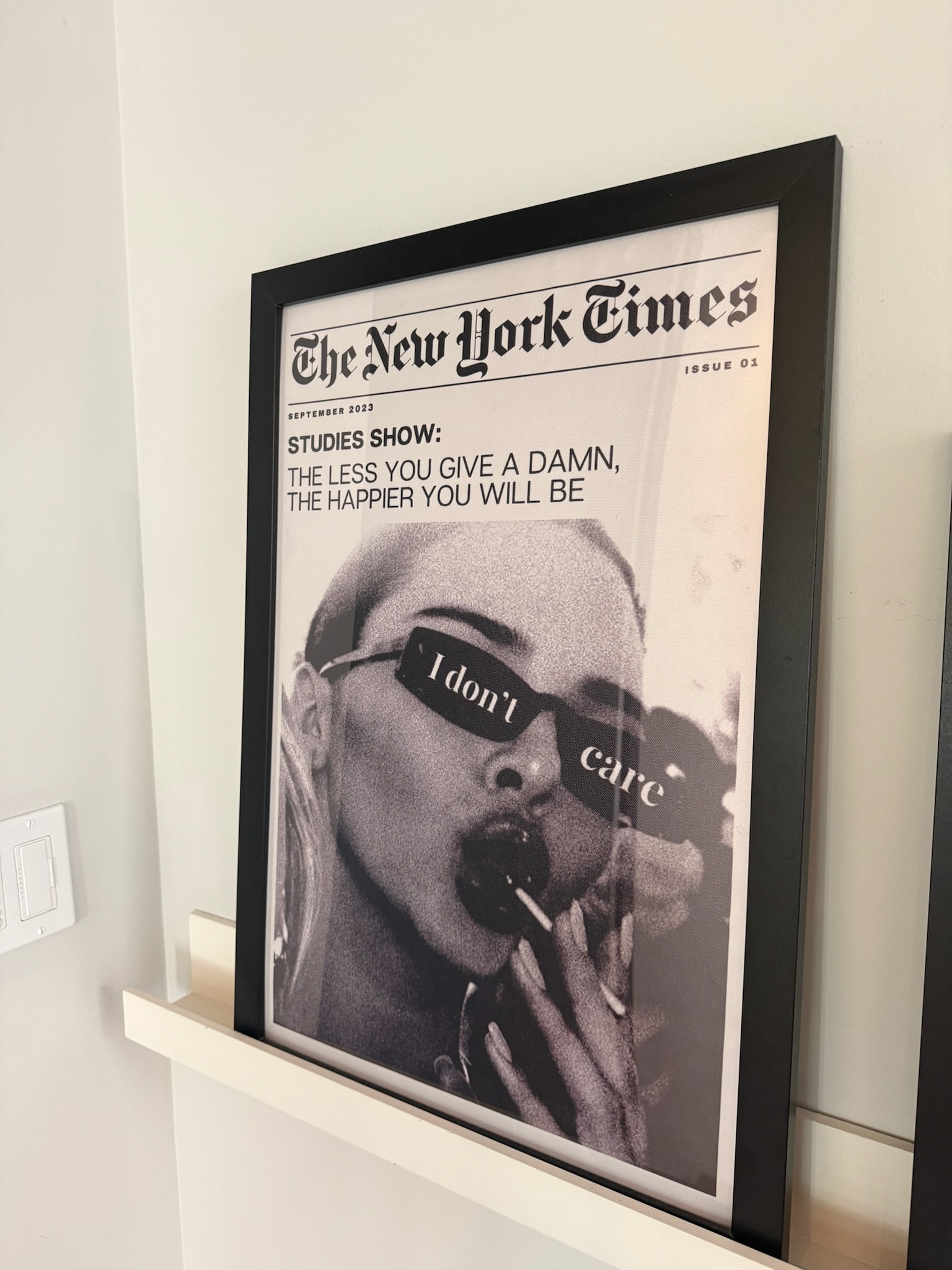 Framed New York Times newspaper parody poster