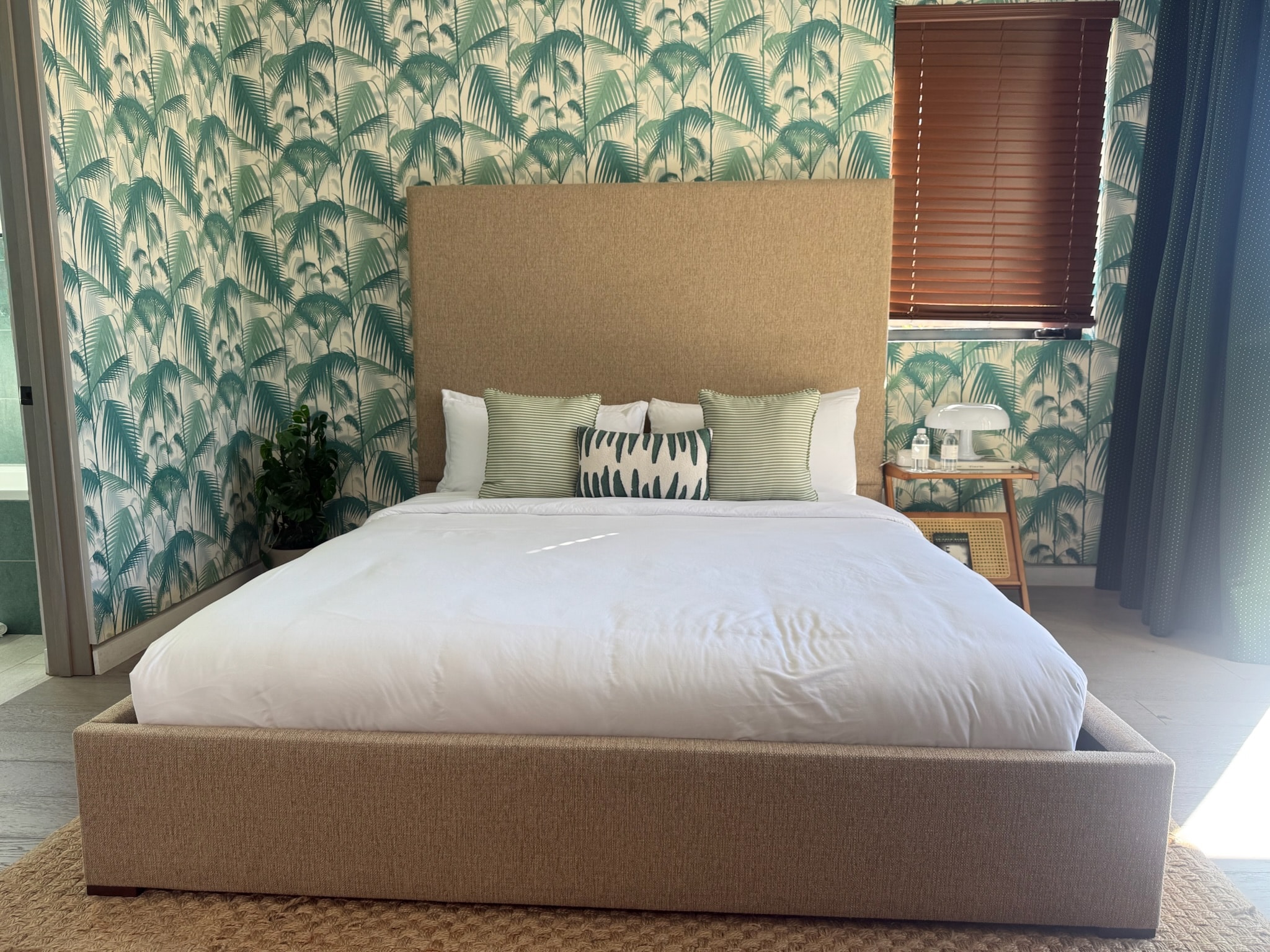 Modern bedroom with tropical palm wallpaper