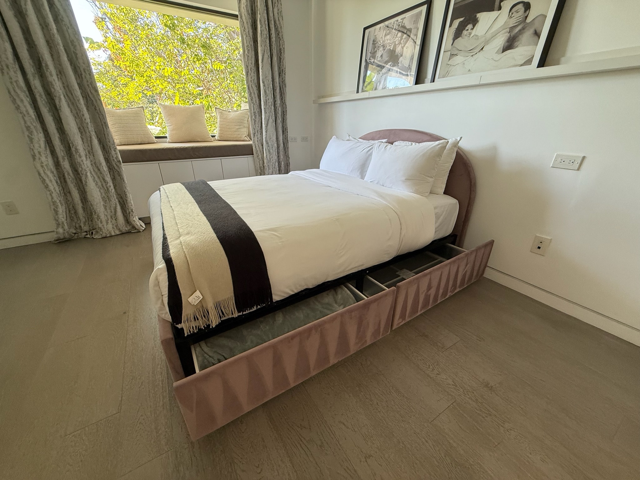 Modern bedroom with storage bed window view